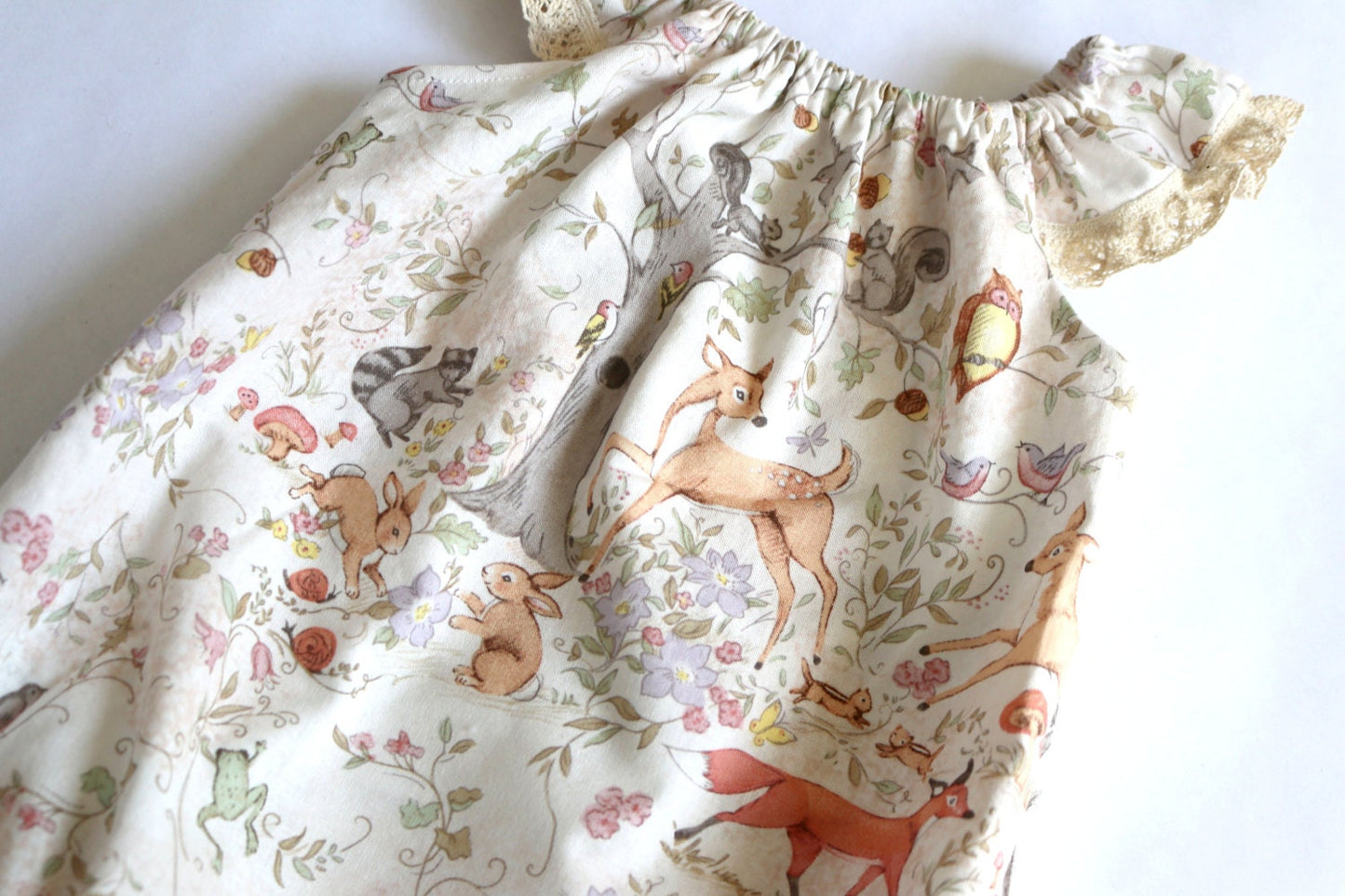 woodland animal baby girl bubble romper- a sweet baby shower gift or coming home outfit, features foxes, deer, birds and squirrels