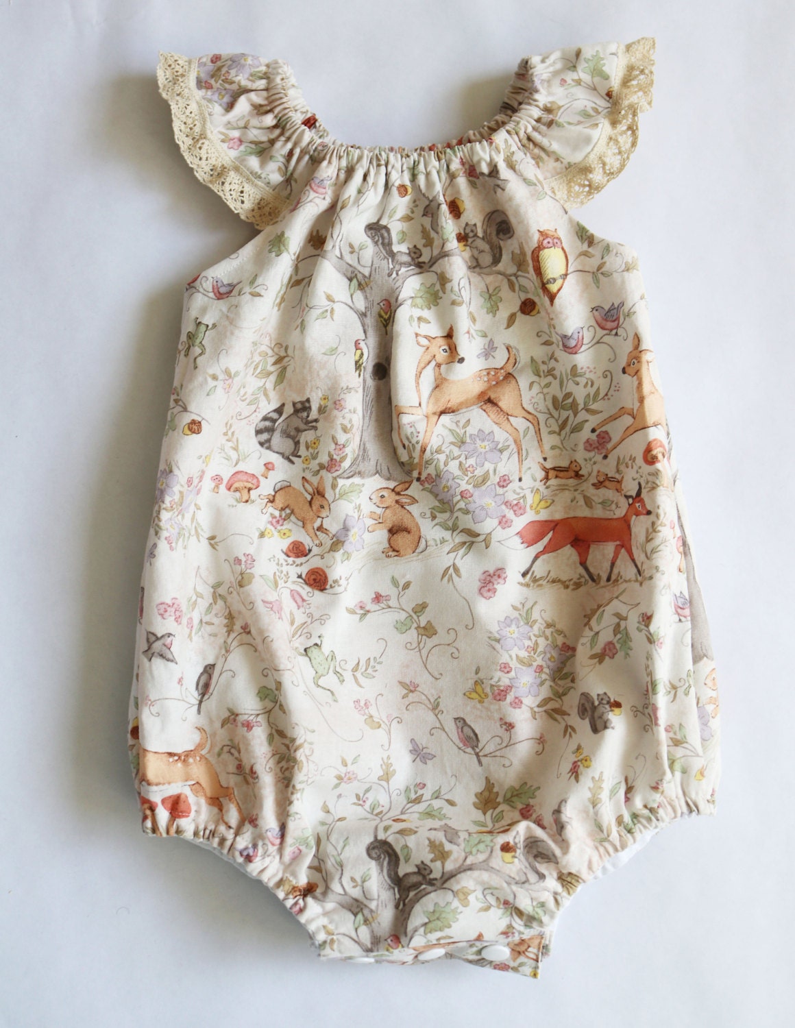 woodland animal baby girl bubble romper- a sweet baby shower gift or coming home outfit, features foxes, deer, birds and squirrels